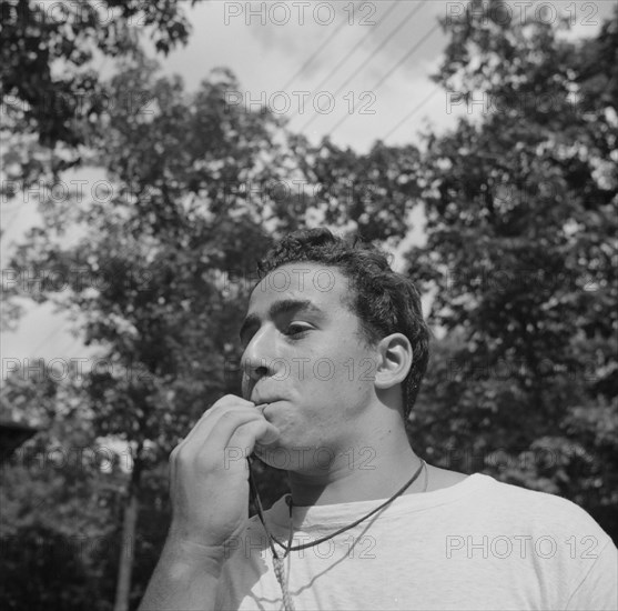 The town crier, Danny Poocchiari., Camp Nathan Hale, Southfields, New York, 1943 Creator: Gordon Parks.