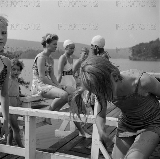 Sun bathing on Lake Tiorati, Camp Christmas Seals, Haverstraw, New York, 1943. Creator: Gordon Parks.