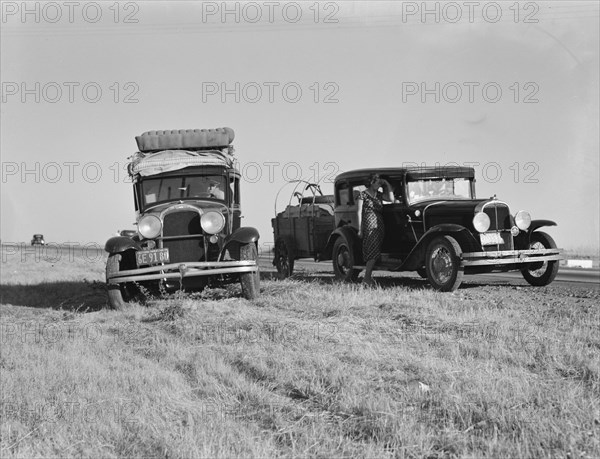 Two families originating from Independence, Kansas, on U.S. 99, between Tulare and Fresno, 1939. Creator: Dorothea Lange.