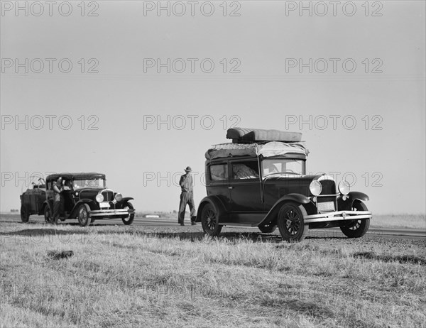 Two families originating from Independence, Kansas, US99, between Tulare and Fresno, 1939. Creator: Dorothea Lange.