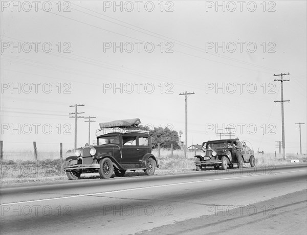 Two families originating from Independence, Kansas, U.S. 99, between Tulare and Fresno, 1939. Creator: Dorothea Lange.