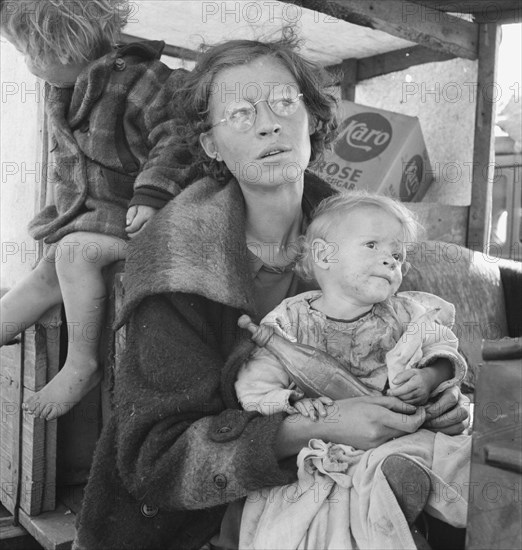 Family, one month from South Dakota, now on the road..., Tulelake, Siskiyou County, California, 1939 Creator: Dorothea Lange.