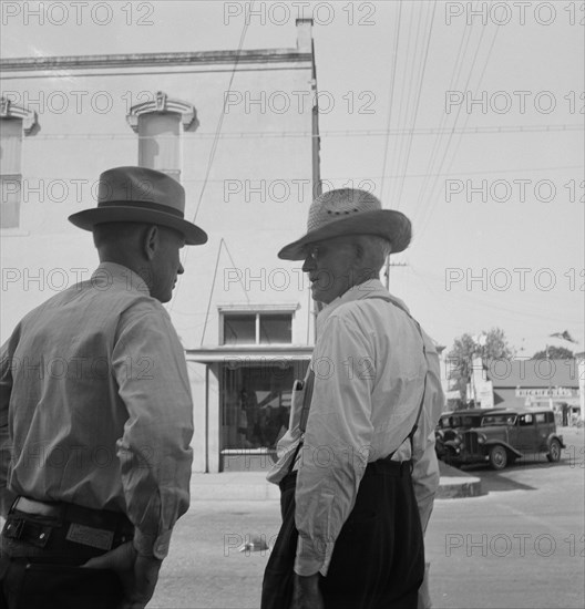 Possibly: Williamette Valley hop farmers in town hold their..., Independence, Oregon, 1939. Creator: Dorothea Lange.