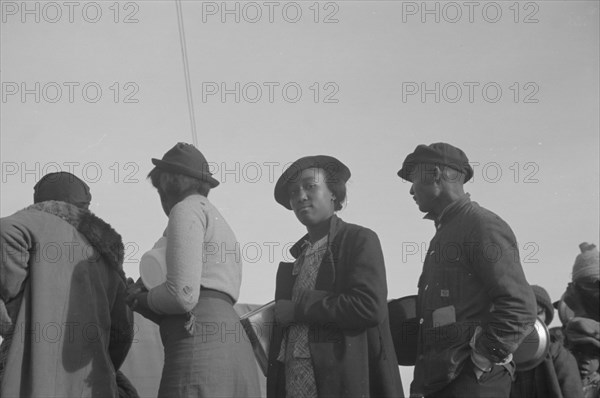 Possibly: Negroes in the lineup for food at meal time in the camp..., Forrest City, Arkansas, 1937. Creator: Walker Evans.