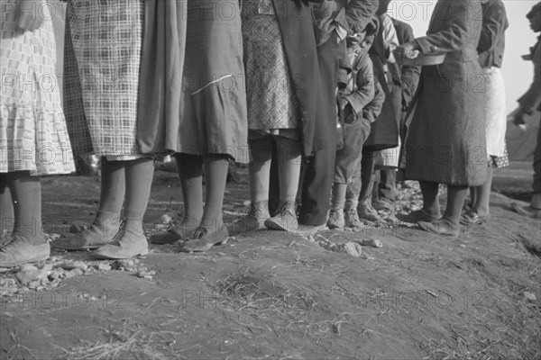 Possibly: Negroes in the lineup for food at meal time in the camp..., Forrest City, Arkansas, 1937. Creator: Walker Evans.