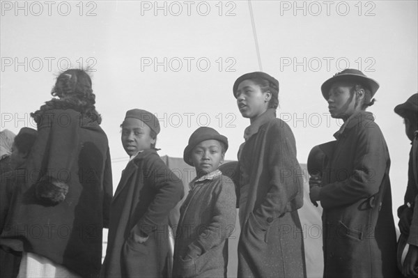 Possibly: Negroes in the lineup for food at meal time in the camp..., Forrest City, Arkansas, 1937. Creator: Walker Evans.