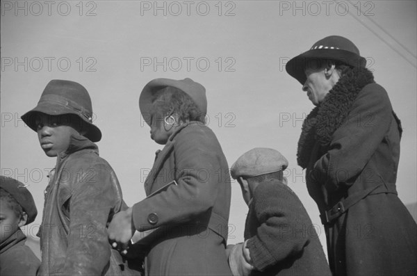 Possibly: Negroes in the lineup for food at mealtime in the camp..., Forrest City, Arkansas, 1937. Creator: Walker Evans.