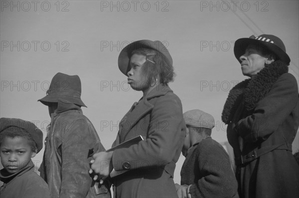 Possibly: Negroes in the lineup for food at mealtime in the camp..., Forrest City, Arkansas, 1937. Creator: Walker Evans.