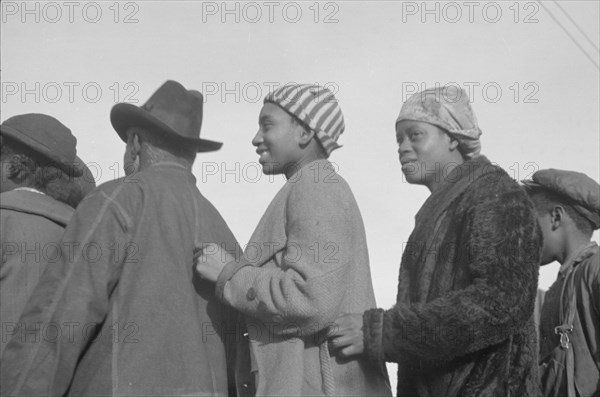 Possibly: Negroes in the lineup for food at mealtime in the camp..., Forrest City, Arkansas, 1937. Creator: Walker Evans.