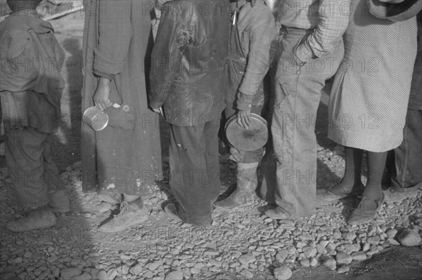 Possibly: Negroes in the lineup for food at mealtime in the camp..., Forrest City, Arkansas, 1937. Creator: Walker Evans.