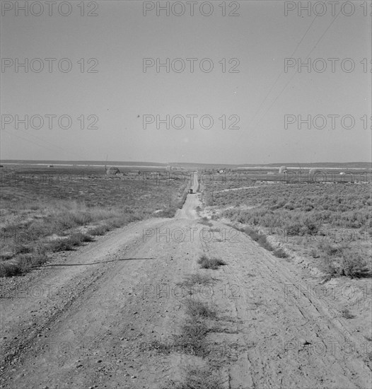 The cream truck coming down the road..., Nyssa Heights, Malheur County, Oregon, 1939. Creator: Dorothea Lange.