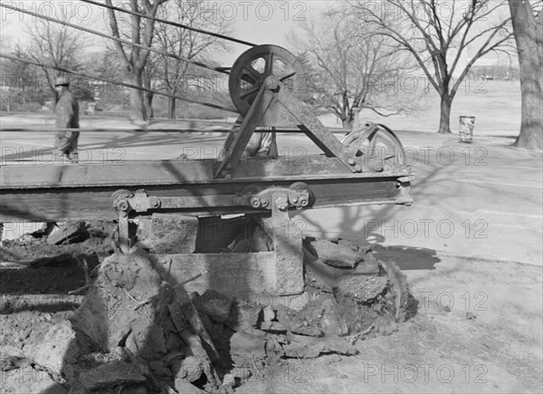 Possibly: Clearing earth and old paving for extension...at Fourteenth, Washington, D.C, 1942. Creator: Dorothea Lange.