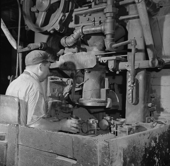 A core blowing machine, New Britain, Connecticut, 1943. Creator: Gordon Parks.