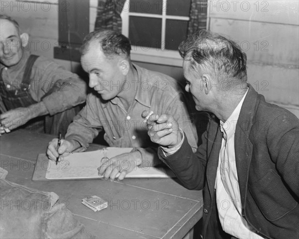 Meeting of the camp council, FSA camp, Farmersville, California, 1939. Creator: Dorothea Lange.