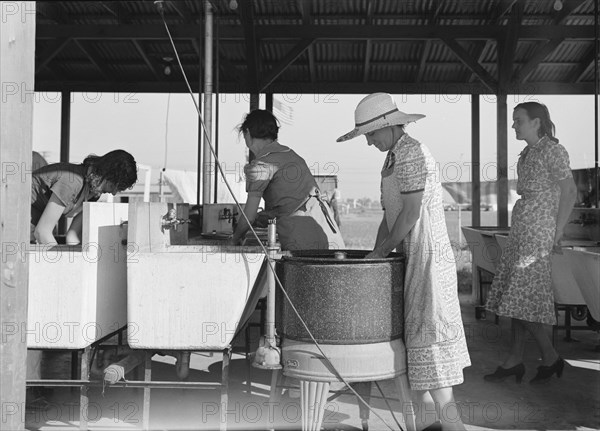 Laundry facilities in FSA migrant labor camp, Westley, California, 1939. Creator: Dorothea Lange.