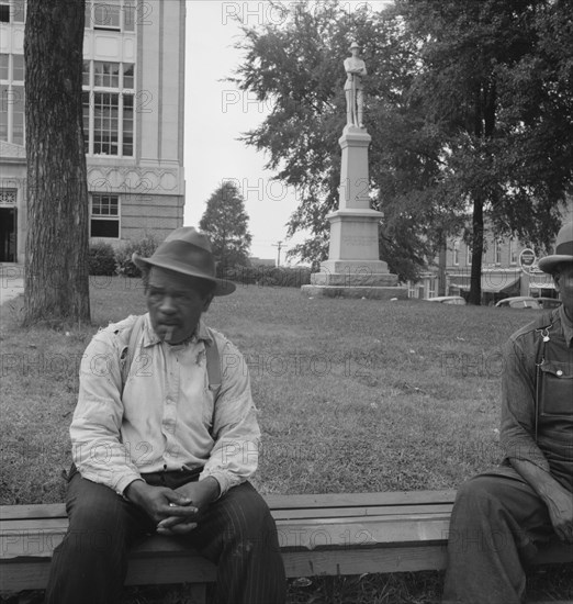 Men idling around the courthouse square, Roxboro, North Carolina, 1939. Creator: Dorothea Lange.