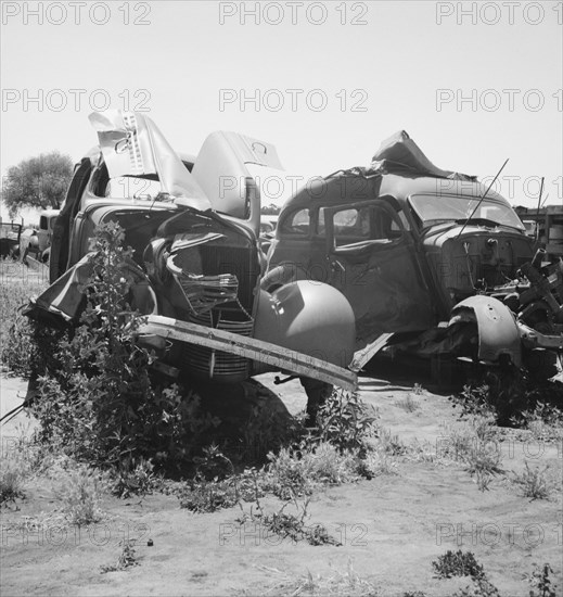 Used car lots and auto wrecking establishments, U.S. 99,  Near Tulare, California, 1939. Creator: Dorothea Lange.