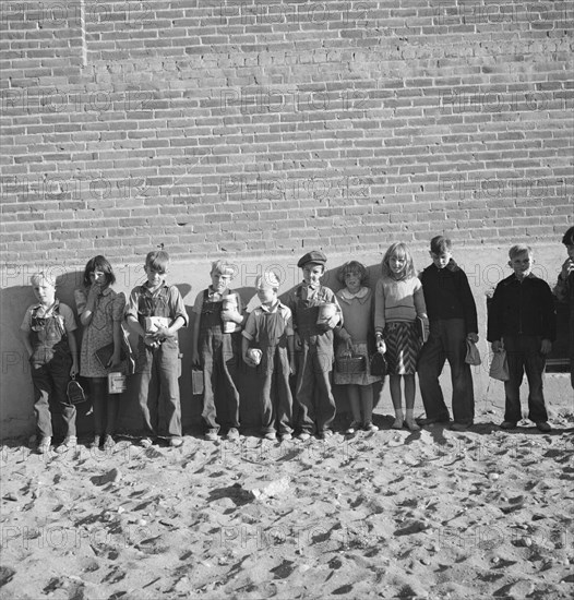 The children from Dead Ox Flat ready to march into the school..., Malheur County, Oregon, 1939. Creator: Dorothea Lange.