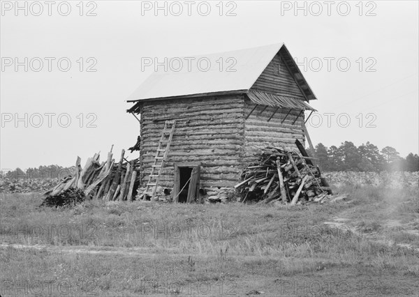 Tobacco barn without front shelter, Person County, North Carolina, 1939. Creator: Dorothea Lange.