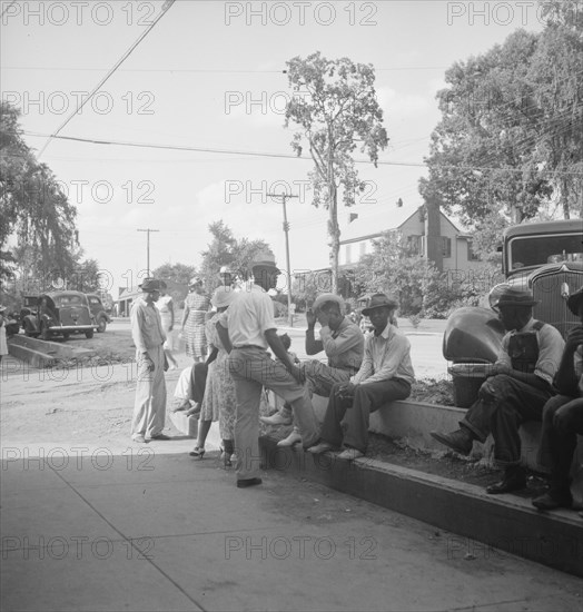 Possibly: Saturday afternoon shopping and visiting on main street of Pittsboro, North Carolina, 1939 Creator: Dorothea Lange.