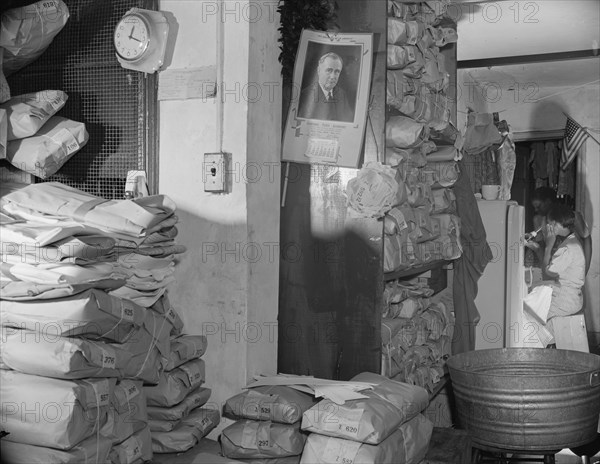 Interior of a Chinese laundry located under the apartment of..., Washington, D.C., 1942. Creator: Gordon Parks.