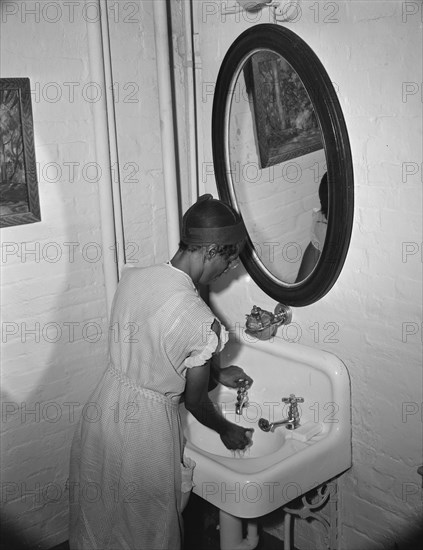 Government charwoman cleaning offices, Washington, D.C., 1942. Creator: Gordon Parks.