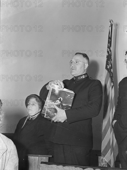 Selling Easter edition of the "War Cry", Salvation army, San Francisco, California, 1939. Creator: Dorothea Lange.