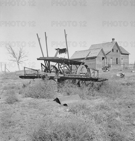 Farm machinery left on abandoned dry land farm in Columbia Basin, Grant County, Washington, 1939. Creator: Dorothea Lange.