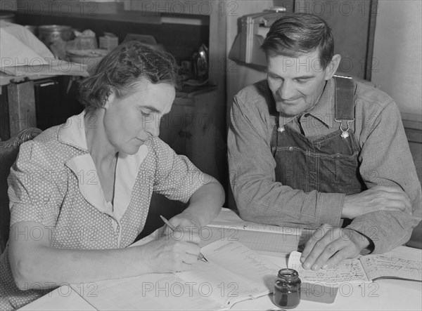 FSA borrowers on new farm keep account of their loan, Dead Ox Flat, Malheur County, Oregon, 1939. Creator: Dorothea Lange.