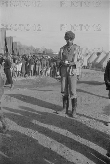 Possibly: Negro with a fur cap, a flood refugee in the camp at Forrest City, Arkansas, 1937. Creator: Walker Evans.