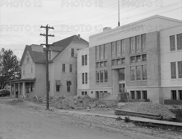 The new WPA courthouse alongside the old county courthouse, Bonners Ferry, Idaho, 1939. Creator: Dorothea Lange.