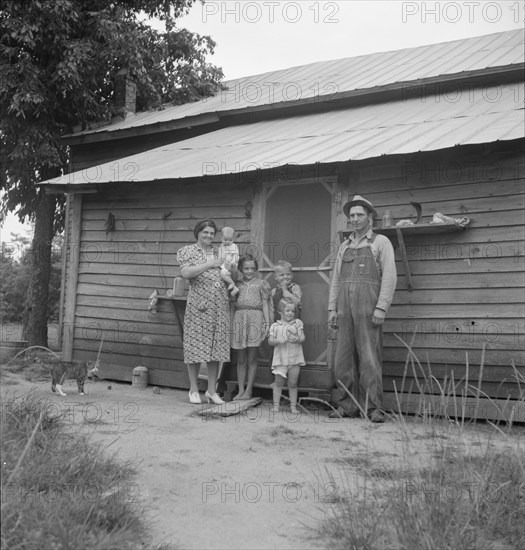 Possibly: Tobacco sharecropper with his oldest daughter, Person County, North Carolina, 1939. Creator: Dorothea Lange.