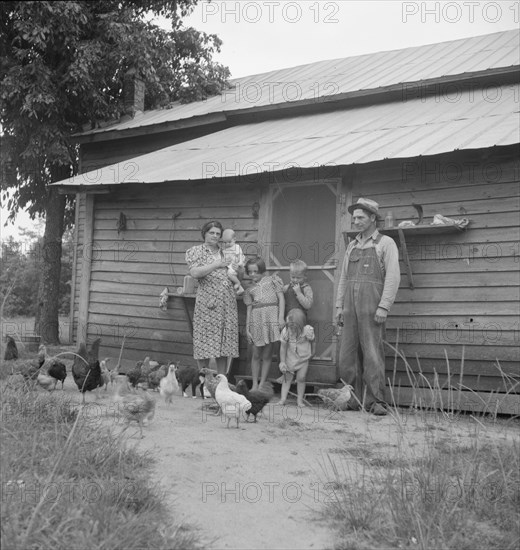 Possibly: Tobacco sharecropper with his oldest daughter, Person County, North Carolina, 1939. Creator: Dorothea Lange.