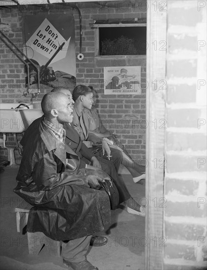 Air raid wardens' meeting in zone nine, Southwest area, Washington, D.C, 1942. Creator: Gordon Parks.