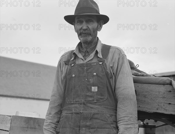 Stump farmer comes to town on a Saturday morning to bring in cream..., Bonners Ferry, Idaho, 1939. Creator: Dorothea Lange.