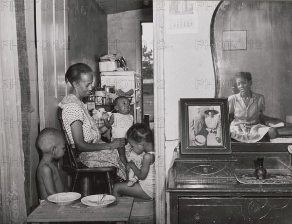 Mrs. Ella Watson, a government charwoman..., Washington, D.C., 1942. Creator: Gordon Parks.