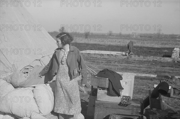 Possibly: A girl in the camp for white flood refugees, Forrest City, Arkansas, 1937. Creator: Walker Evans.