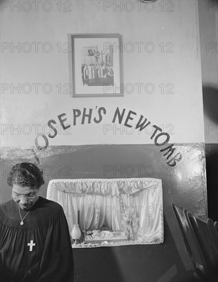 A disciple of the St. Martin's Spiritual Church keeping vigil at Saint..., Washington, D.C., 1942. Creator: Gordon Parks.