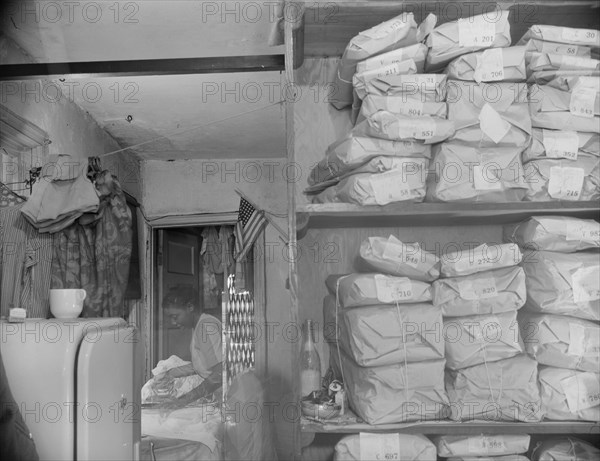 Possibly: Johnnie Lew's Chinese laundry on Monday morning, Washington, D.C., 1942. Creator: Gordon Parks.