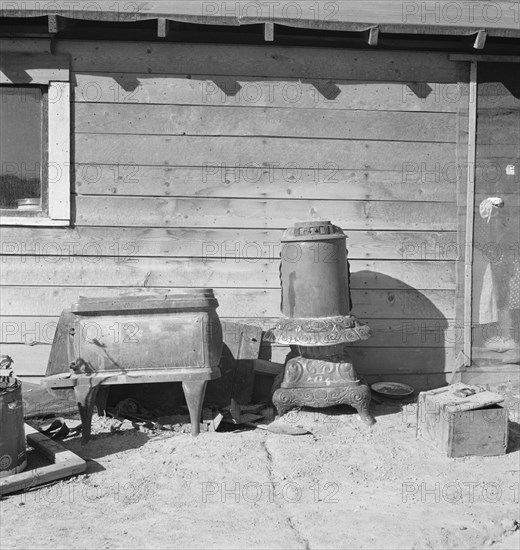 Stoves outside the Browning house being repaired for winter use, Dead Ox Flat, Oregon, 1939. Creator: Dorothea Lange.