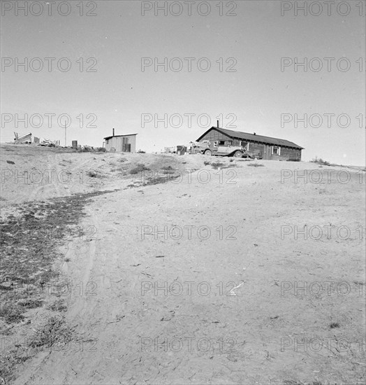 The Browning home, a partial dugout, Dead Ox Flat, Malheur County, Oregon, 1939. Creator: Dorothea Lange.