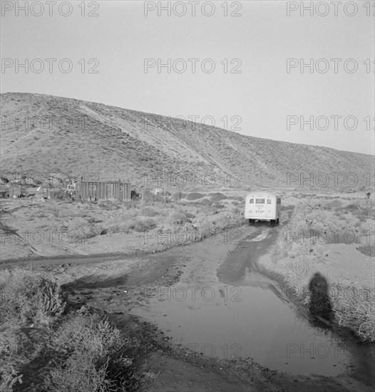 School bus starts up the flat 7:30 a.m. to collect..., Malheur County, Oregon, 1939. Creator: Dorothea Lange.