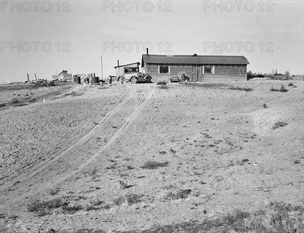 The Browning home, a partial dugout, Dead Ox Flat, Malheur County, Oregon, 1939. Creator: Dorothea Lange.