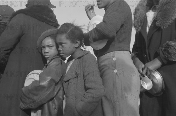 Negroes in the lineup for food at meal time at the camp for flood refugees, Forrest City, Arkansas.