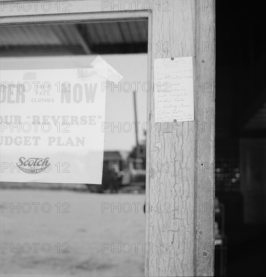 Sign on post office door: Farm animals and household equipment for sale. Vader, western Washington.