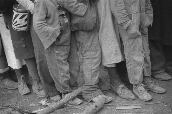 Negroes in the lineup for food at mealtime in the camp for flood refugees, Forrest City, Arkansas.