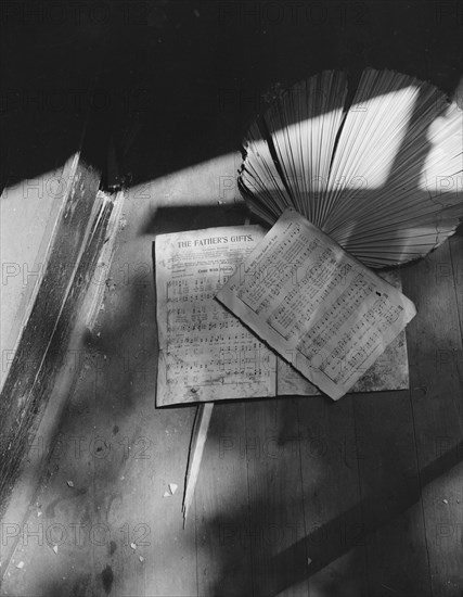 Washington, D.C. Song sheets and a fan left behind in an abandoned church on Independence Avenue.