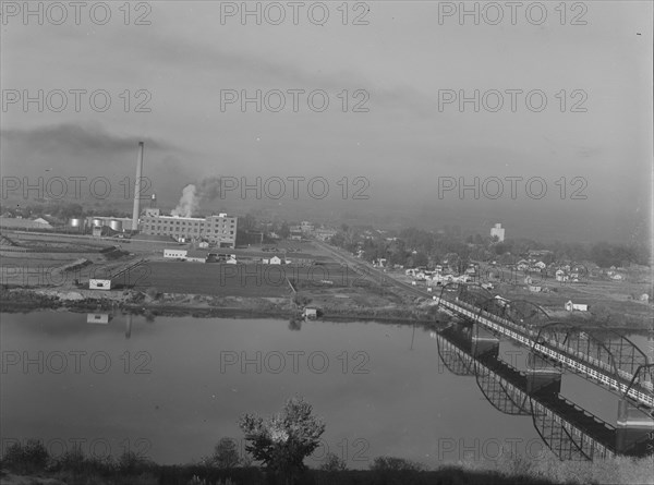 Sugar beet factory along Snake River. Shows beet dump, beet pile. Nyssa, Malheur County, Oregon.