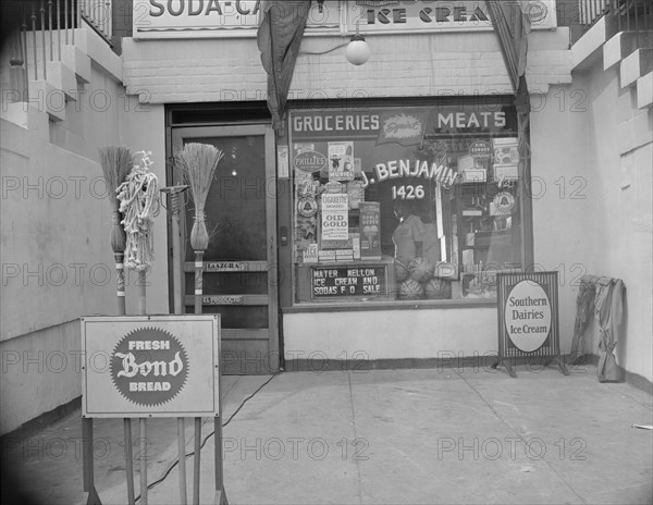 Washington, D.C. Grocery store across the street from Mrs. Ella Watson, a government charwoman.