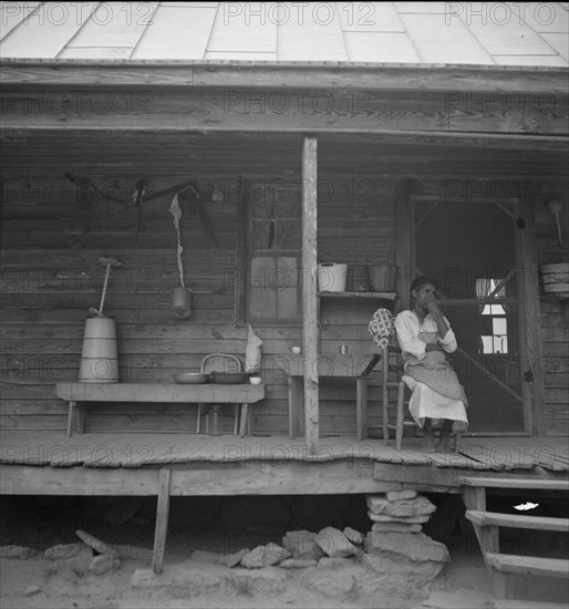 Porch of Negro tenant house, showing household equipment. Person County, North Carolina.